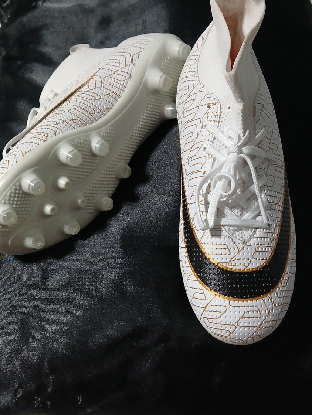 White Athletic Soccer Cleats with Black and Gold Accent